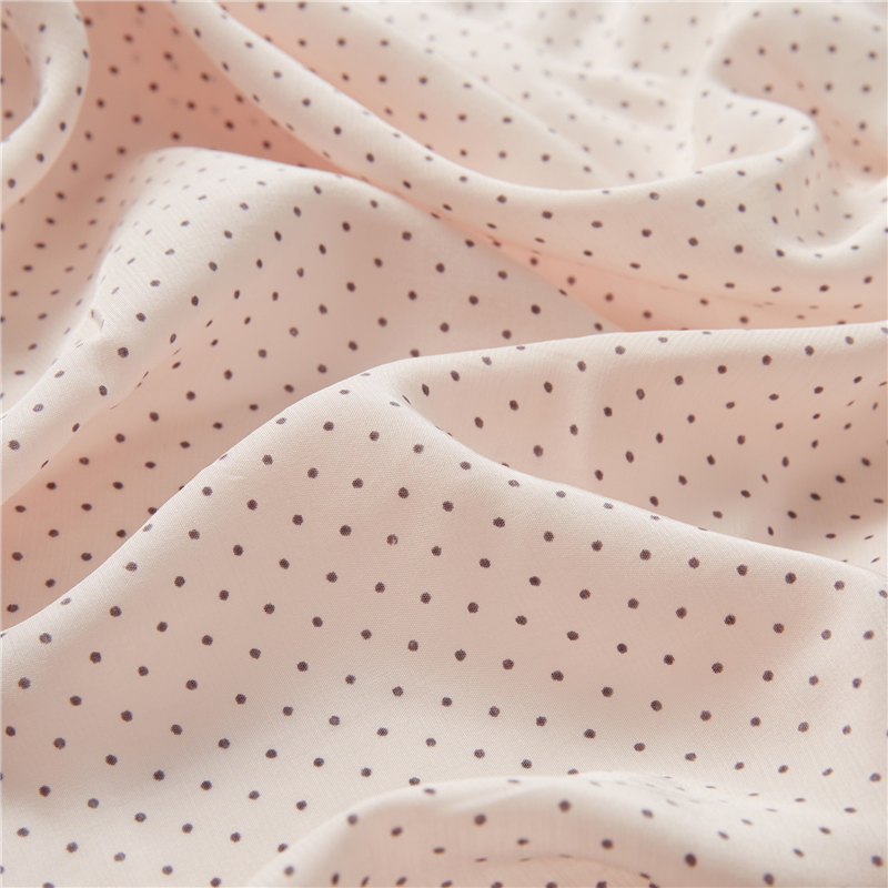 Pois noirs fond rose 51% rayonne 49% viscose popeline formes soyeuses tissu imprimé pois